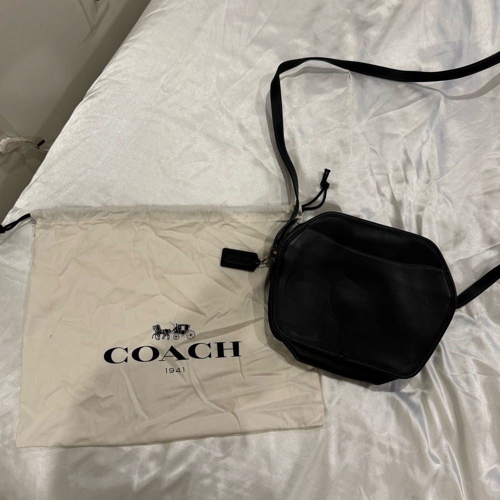 Black Coach bag, never before used. Comes with dust bag.